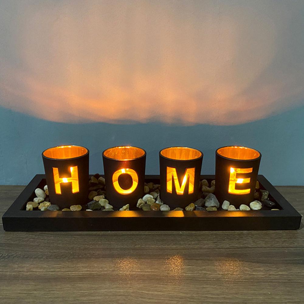 HOME - branded 4pc glass candle holder set with wooden placement and rock pebbles