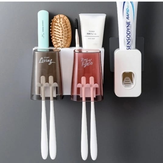 Double cup toothbrush/toothpaste dispenser