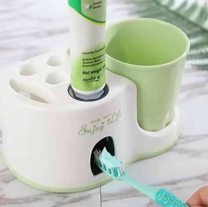 Toothbrush holder with toothpaste dispenser..