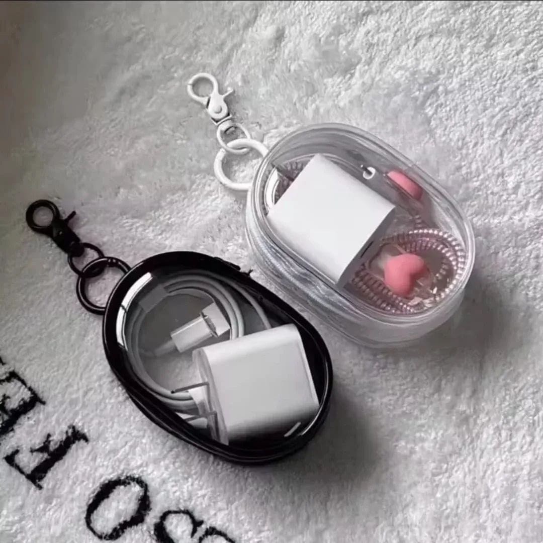 Portable mini transparent zipper pouch with a keychain, designed in an oval shape to neatly organize a phone charger and coiled cable