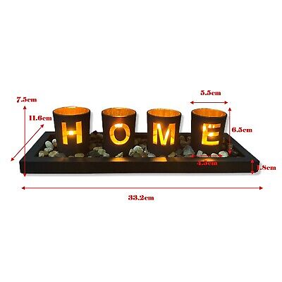 HOME - branded 4pc glass candle holder set with wooden placement and rock pebbles