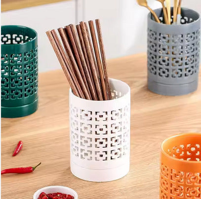 Ceramic cutlery holder with drainer