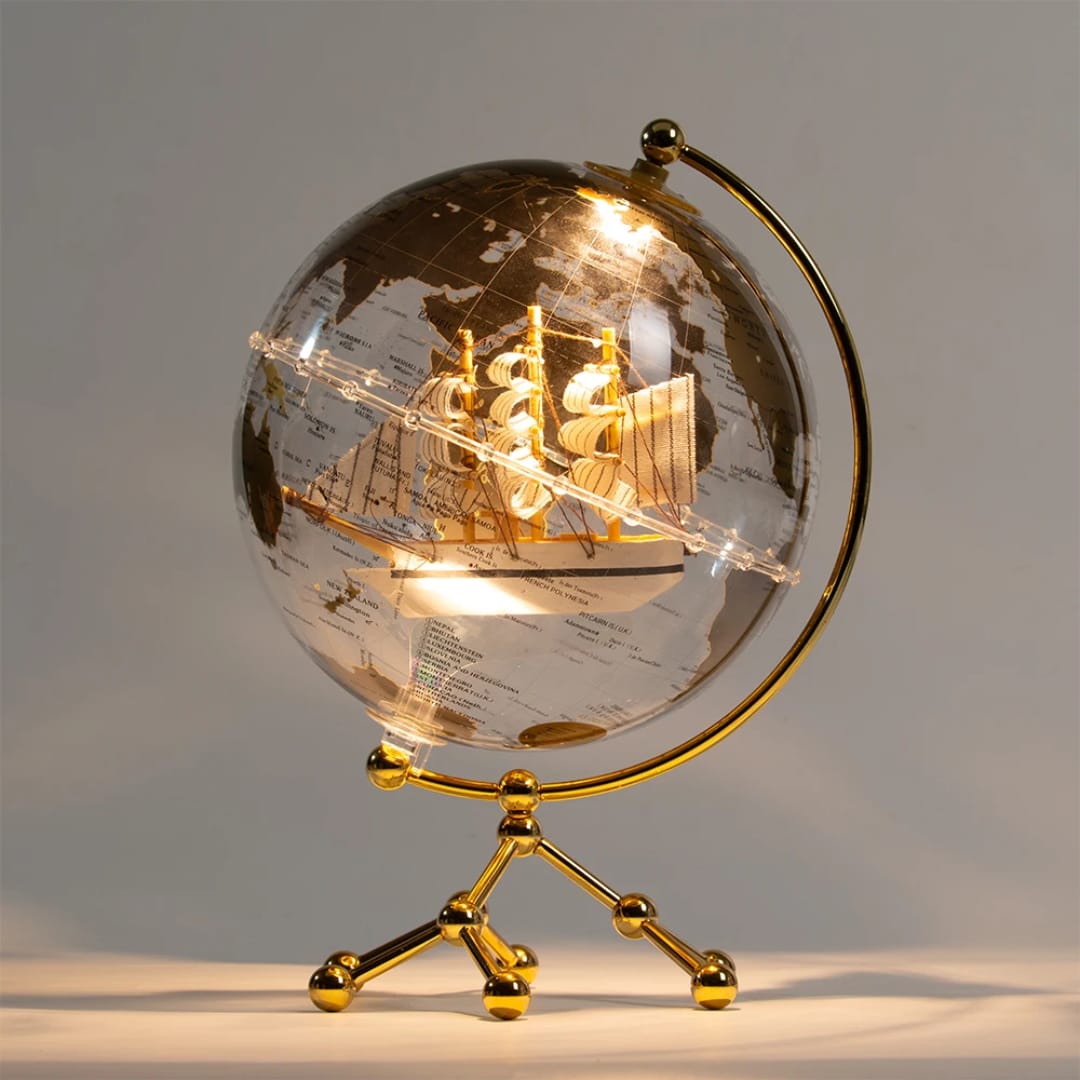 Illuminating LED world globe ornament with metal stand