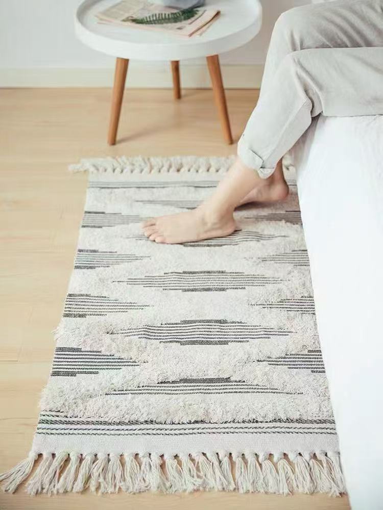Bohemian Nordic style bedroom rug with tassels