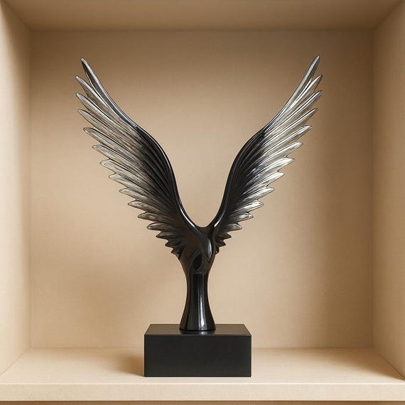 modern black and silver resin eagle wing sculpture mounted on a rectangular base